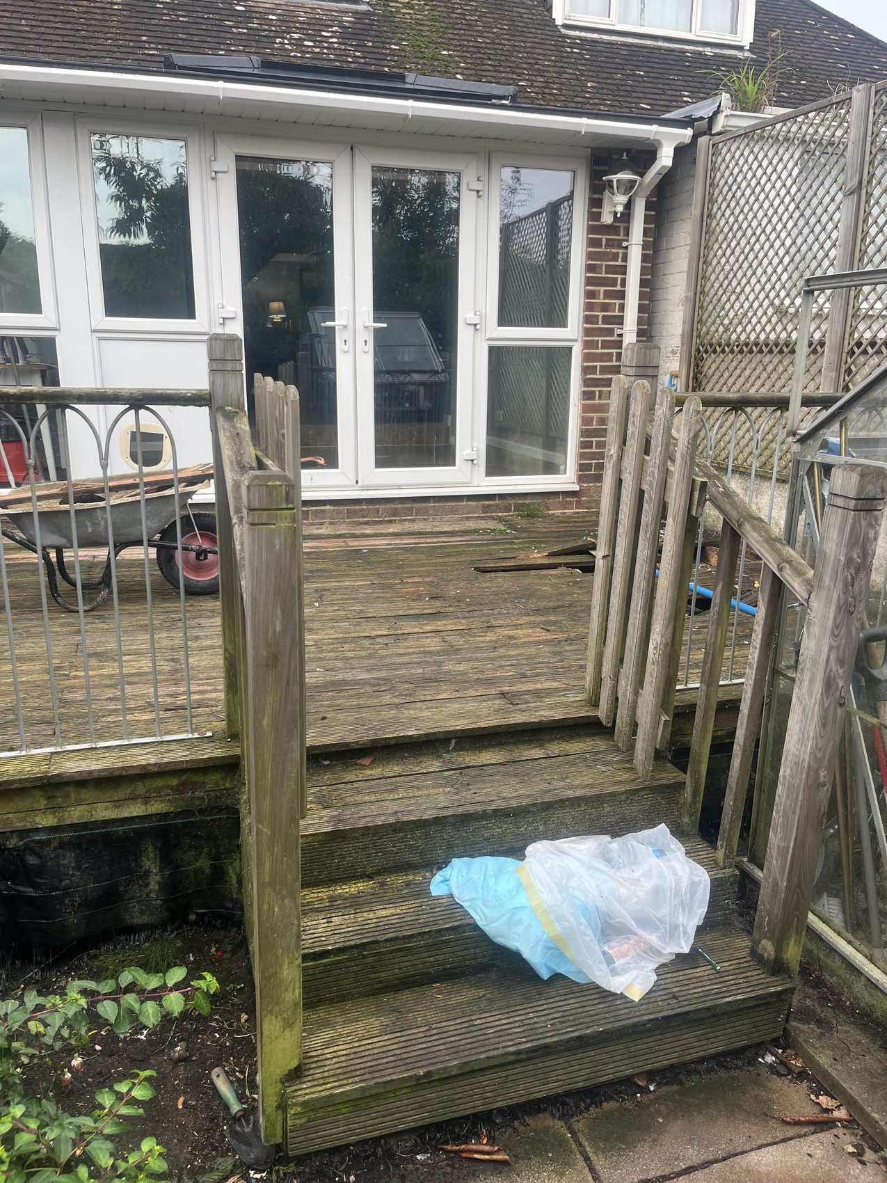 Before: the old timber steps and decking, worn and slick with moss, a trip hazard the customer wanted gone.