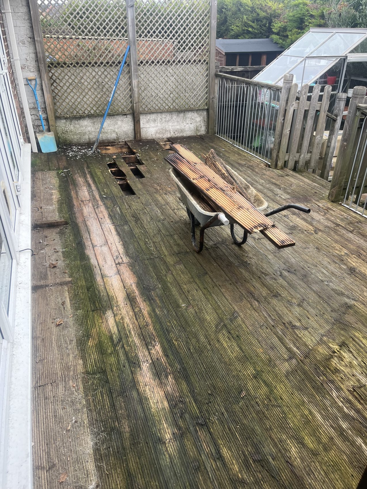 Before: the deck stripped back to bare joists, ready for the rebuild.