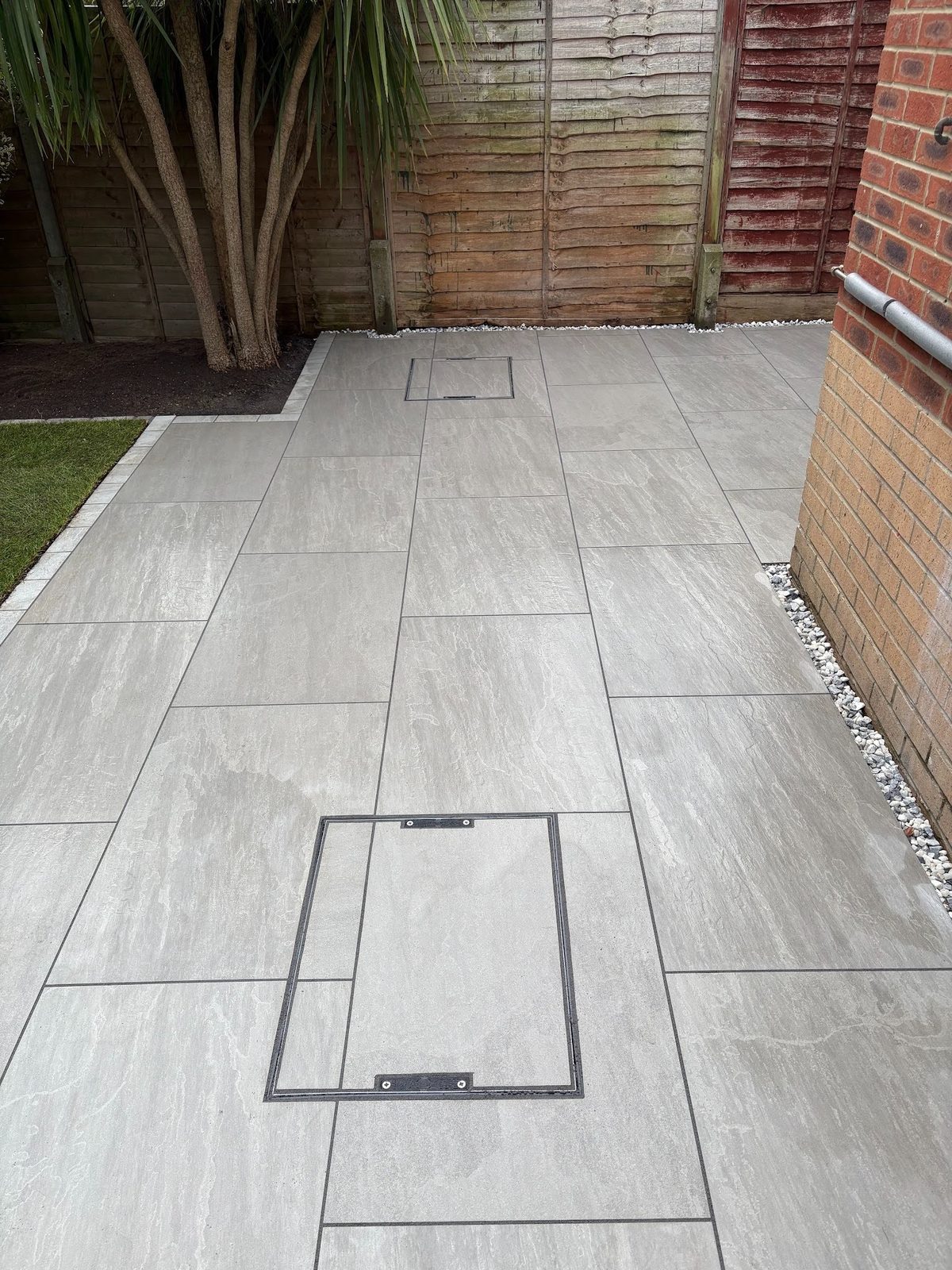 One of three recessed drainage trays, cut and fitted with matching Kandla Grey porcelain inserts for a flush finish.