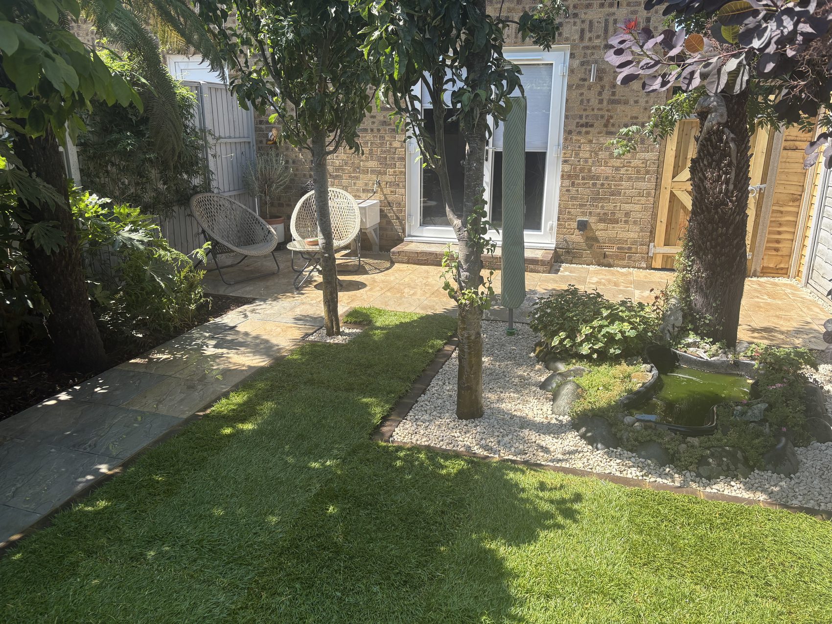 Before: the old, uneven paving slabs and mismatched path leading to the back door.