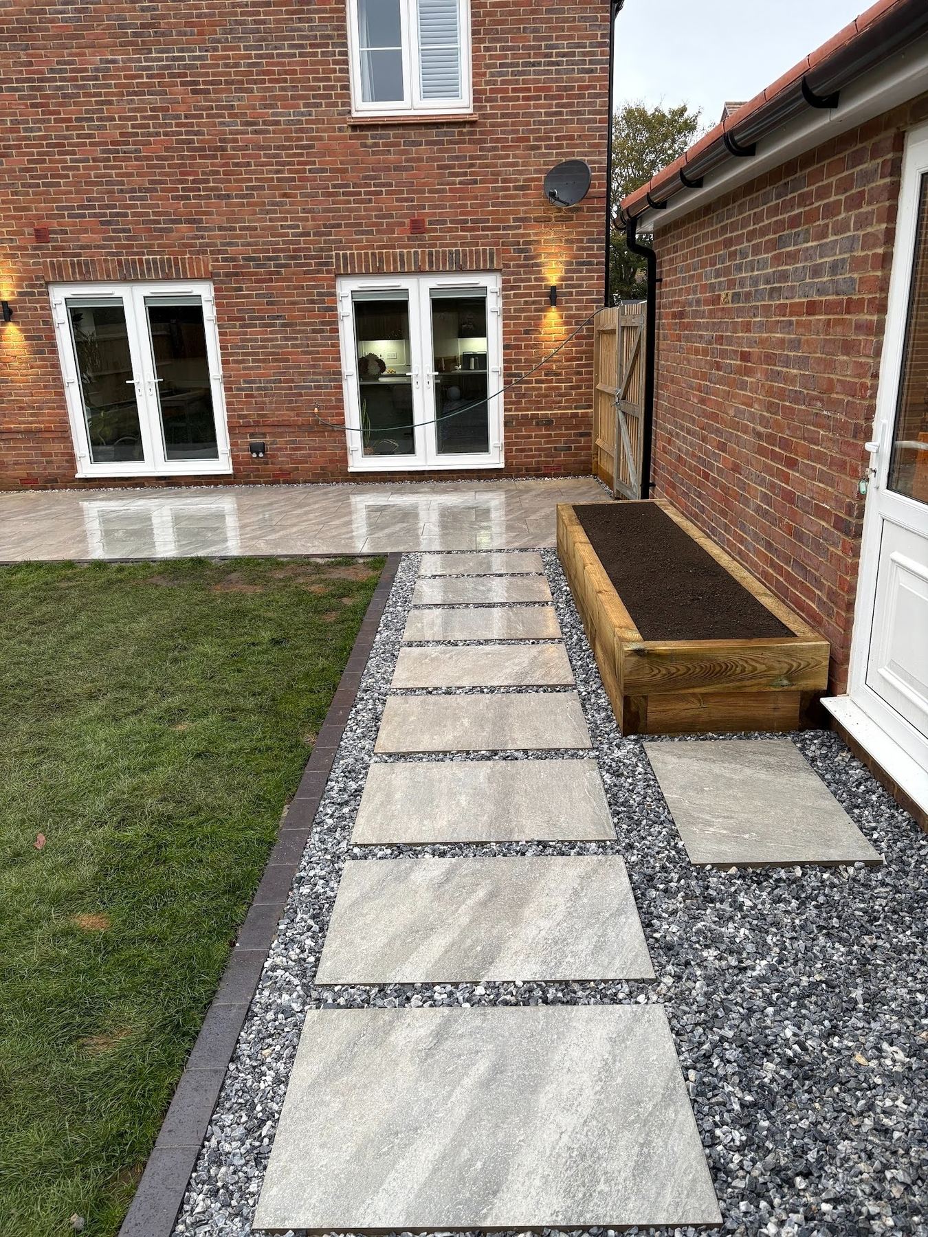 Full composition during the day &mdash; both terraces visible with the stepping path linking the two zones.