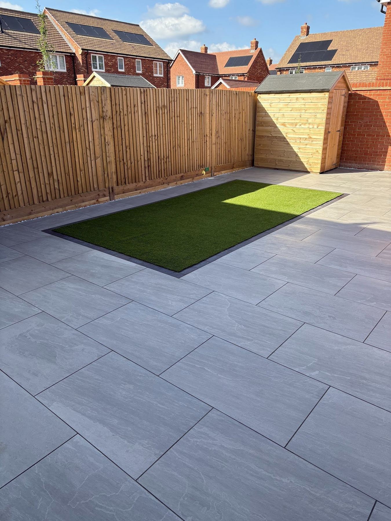 Three-quarter view across both zones with the Astro insert centred and framed in engineering brick.