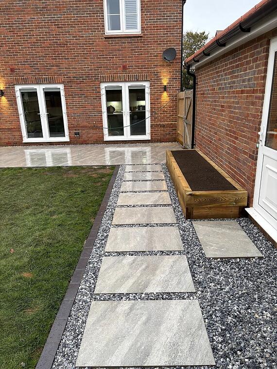 Garden composition, Warsash -- The full composition by day — both terraces visible with the stepping path linking the two zones.