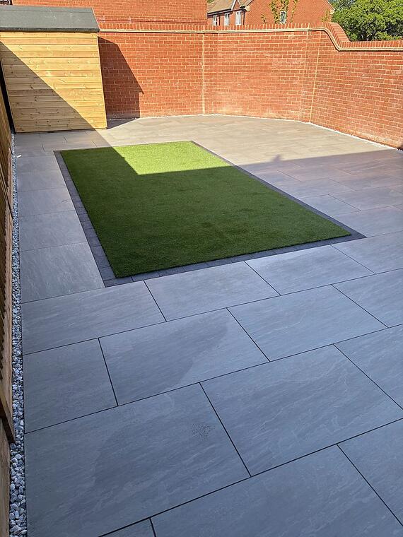 Full hardscape, Warsash -- The full hardscape composition, lighter and darker porcelain zones meeting at the brick frame.